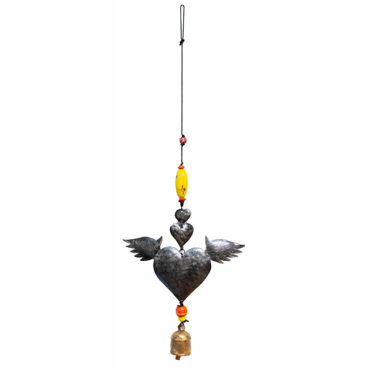 Decorative hanging heart with birds and beads on a white background
